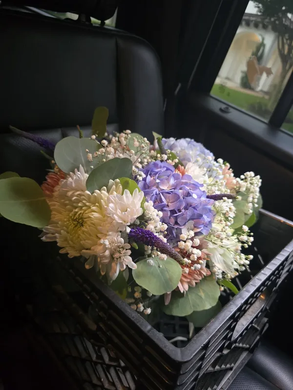 Anniversary flower delivery Houston — blue hydrangea and chrysanthemum arrangement