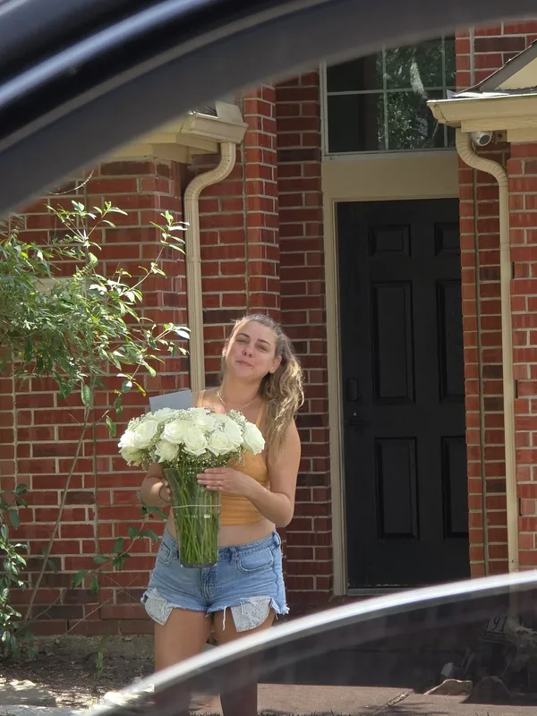Mainly white bridal bouquet of roses handcrafted by Lola in Bloom, a Houston florist